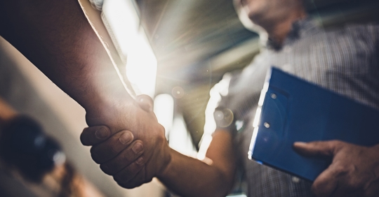 two people shaking hands