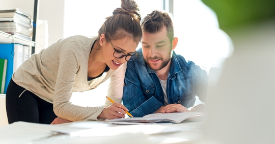 A male and female setting up a plan